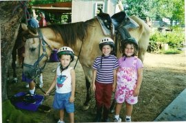 at a summer equine camp for kids with behavior needs in 2001 where we both volunteered so the older kids could get some therapy and socialization.
